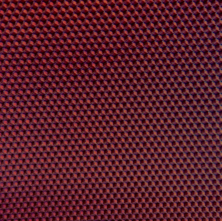 A close up of a burgundy beeswax craft sheet