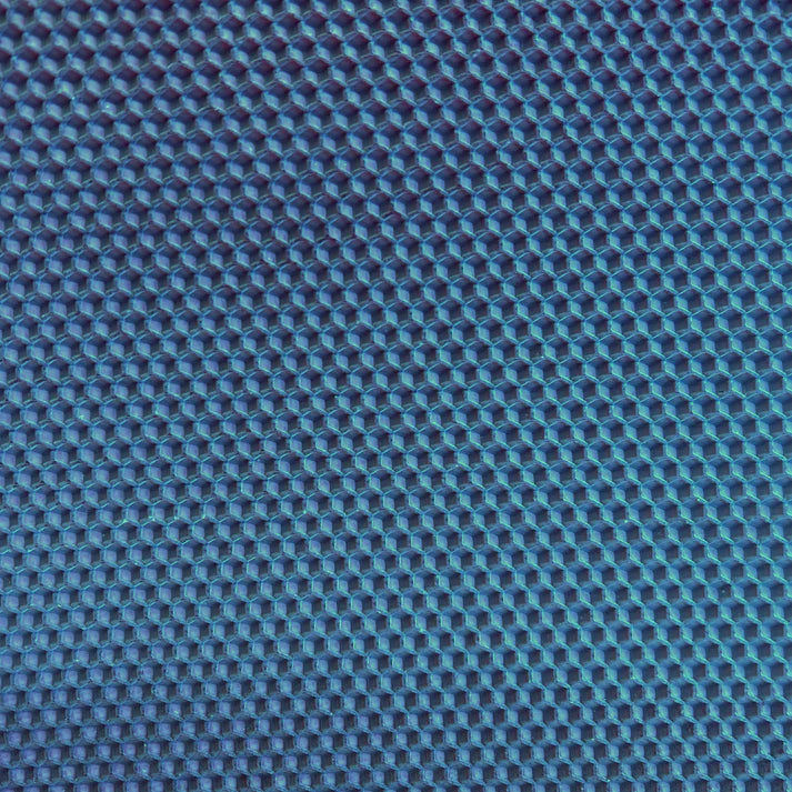 A close up of a dark blue beeswax craft sheet