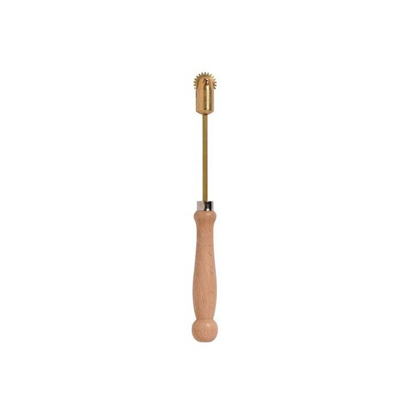 A brass spur tool with a wooden handle, used for securing vertical wires into waxed foundation in beekeeping on a white background