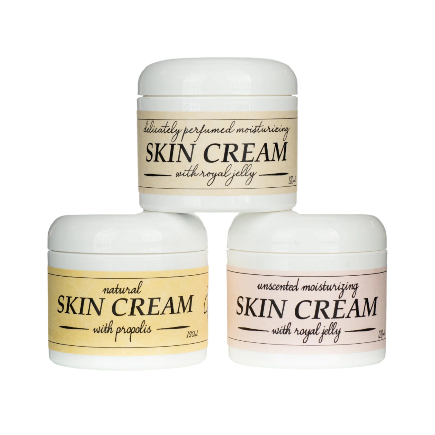 Three jars of skin cream with labels indicating different variations, including natural and unscented, with royal jelly on a white background.