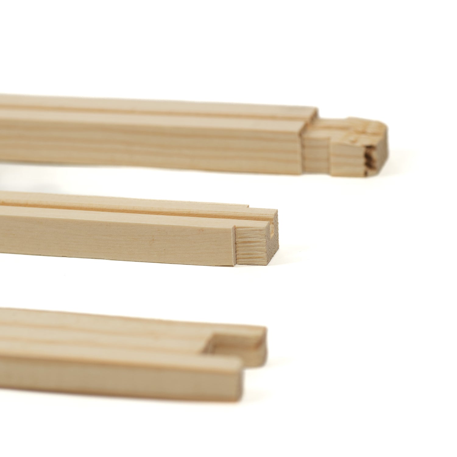 Unassembled wooden frames for beekeeping, displayed in three different orientations to show the structure and components.