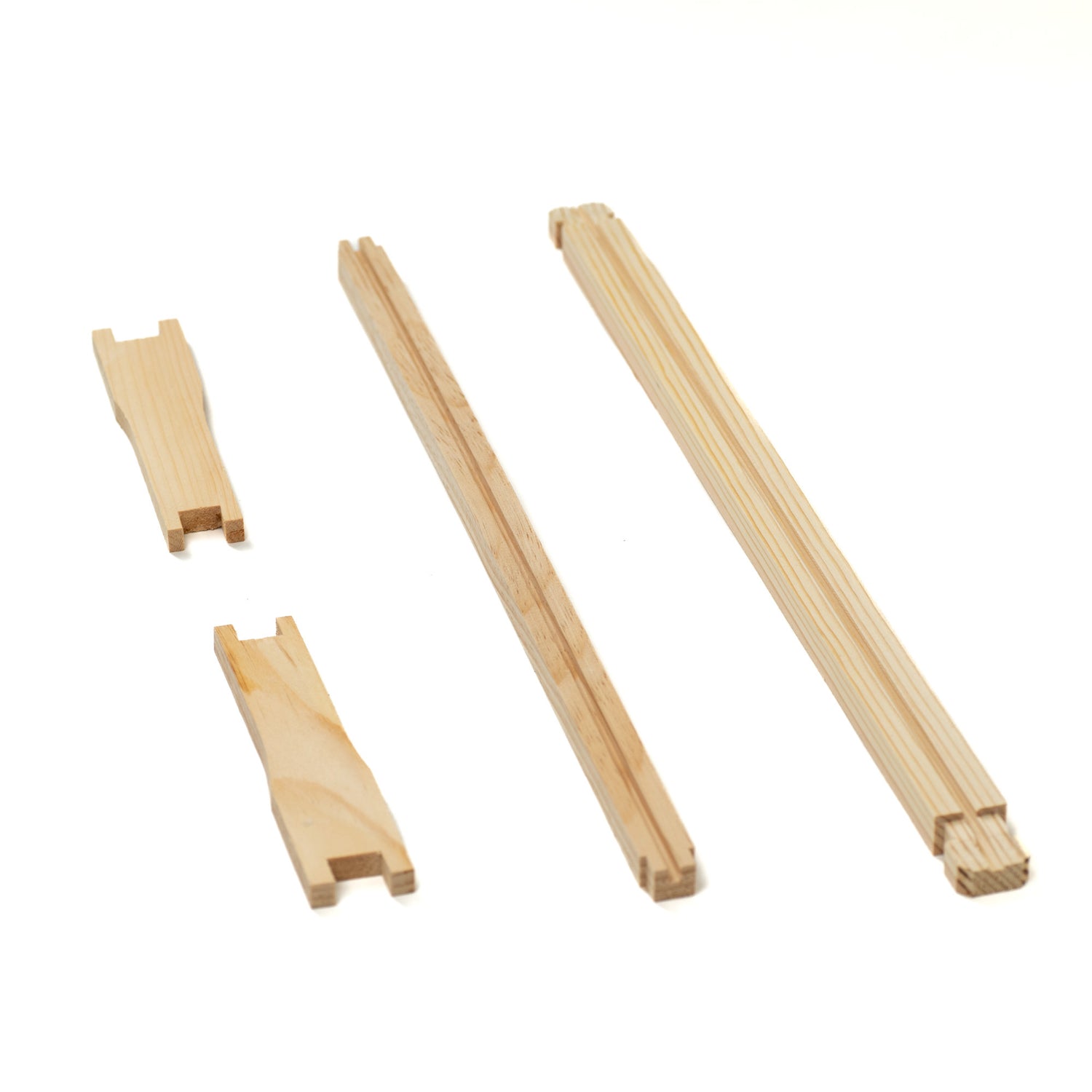 A set of unassembled wooden frame parts for beehives.