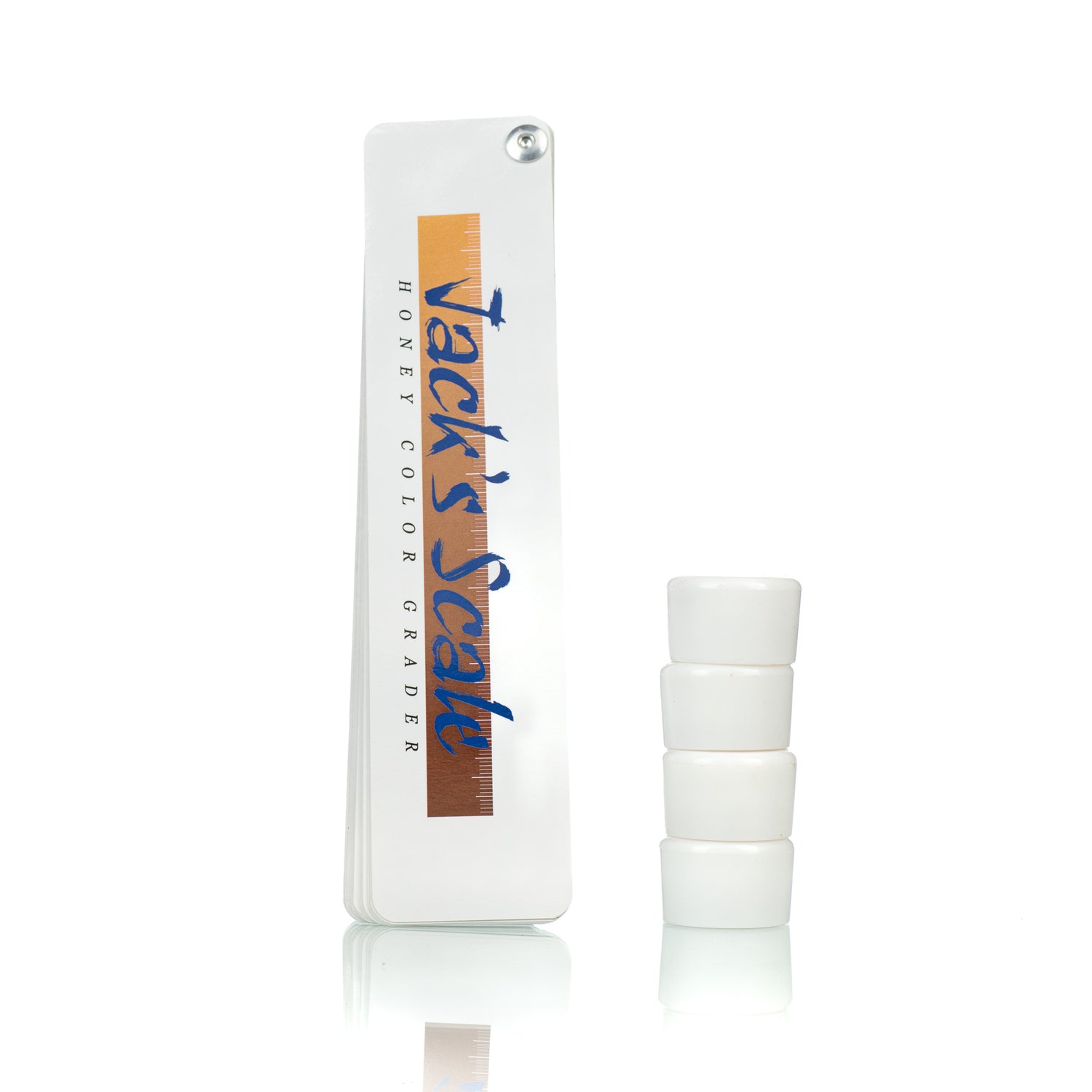 A set of honey color grade standards with sample cups, used for beekeeping and honey processing.