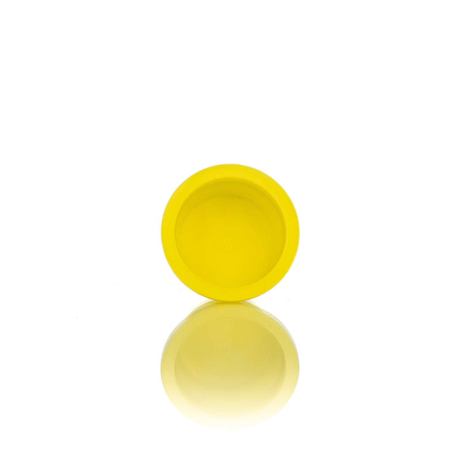 A single yellow plastic plug designed for use in beekeeping.