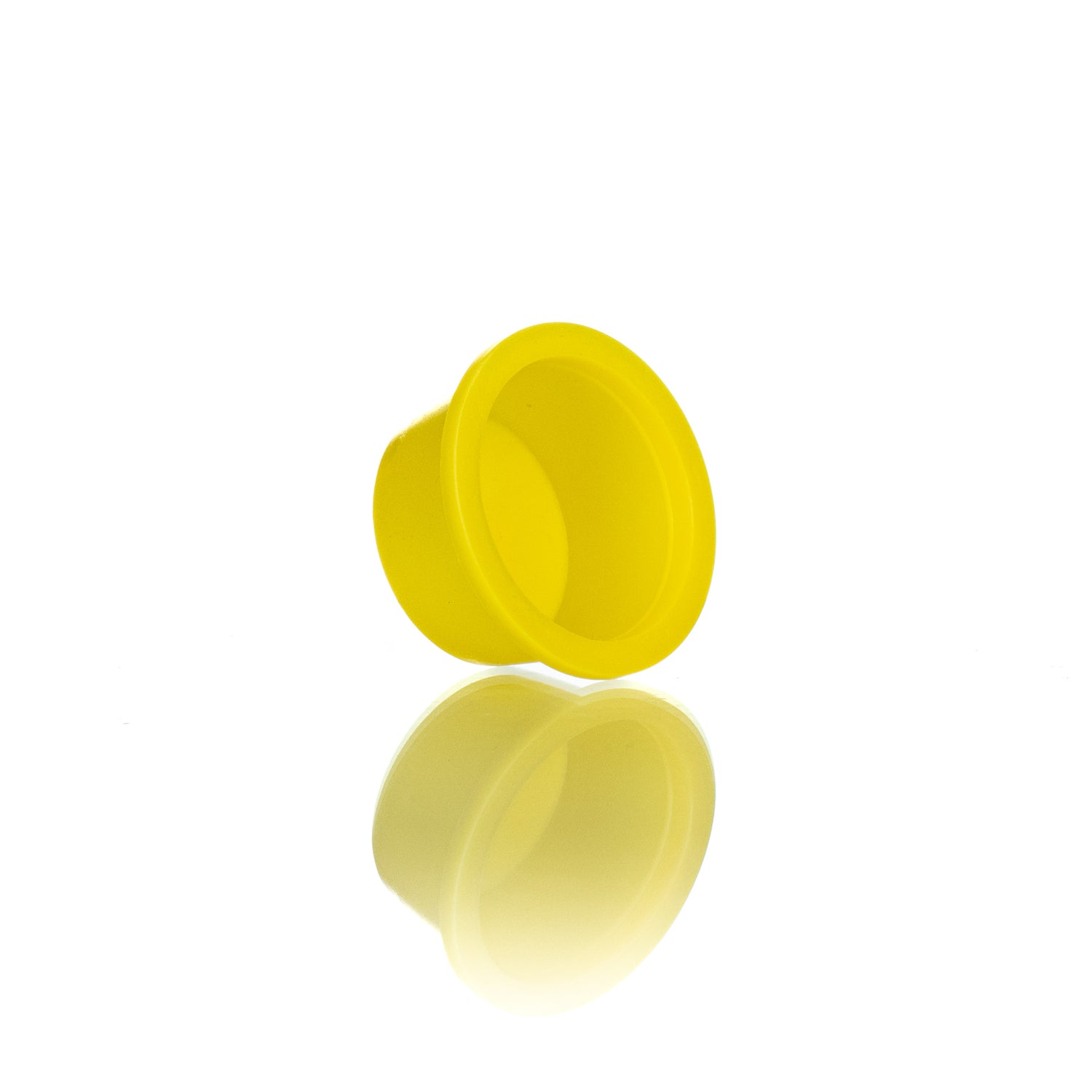 A single yellow plastic plug designed for use in beekeeping.