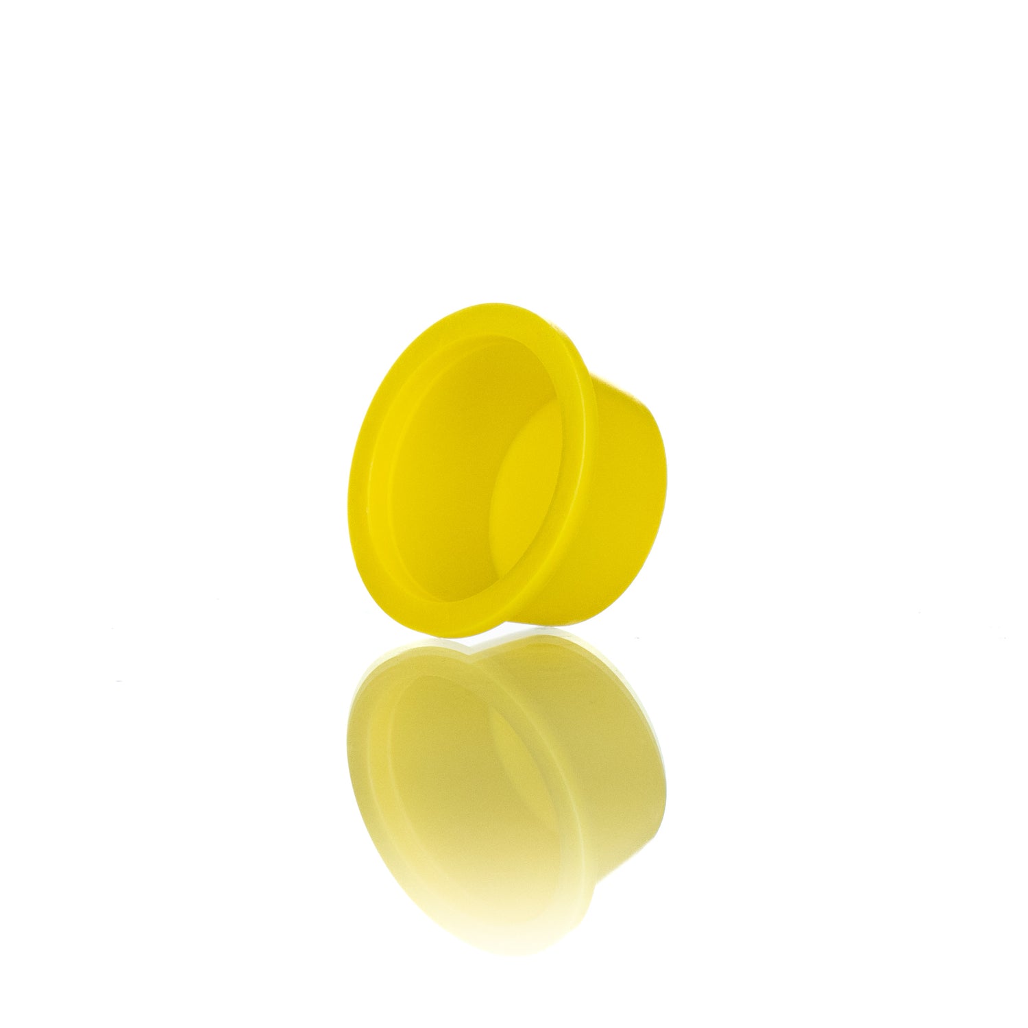 A single yellow plastic plug designed for use in beekeeping.