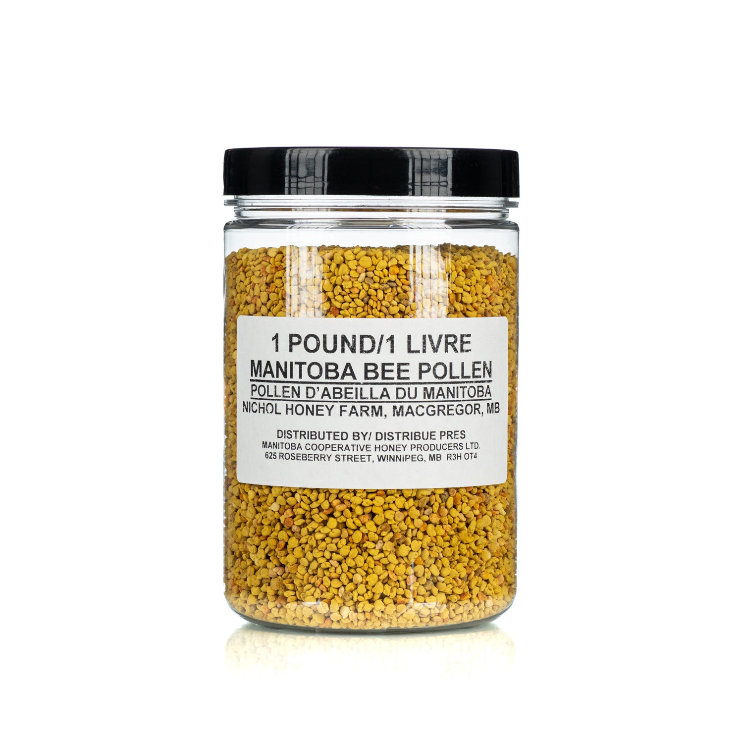 A clear jar containing yellow bee pollen grains. The label on the jar indicates it is 1 pound of Manitoba bee pollen.