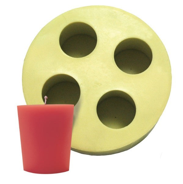 A yellow candle mold with four cavities, each shaped like a flat-top votive candle holder, displayed alongside a red votive candle created using the mold, on a white background