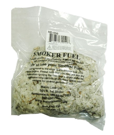 Packaged smoker fuel made from natural cotton fibers and cottonseed husks, labeled for beekeeping use.