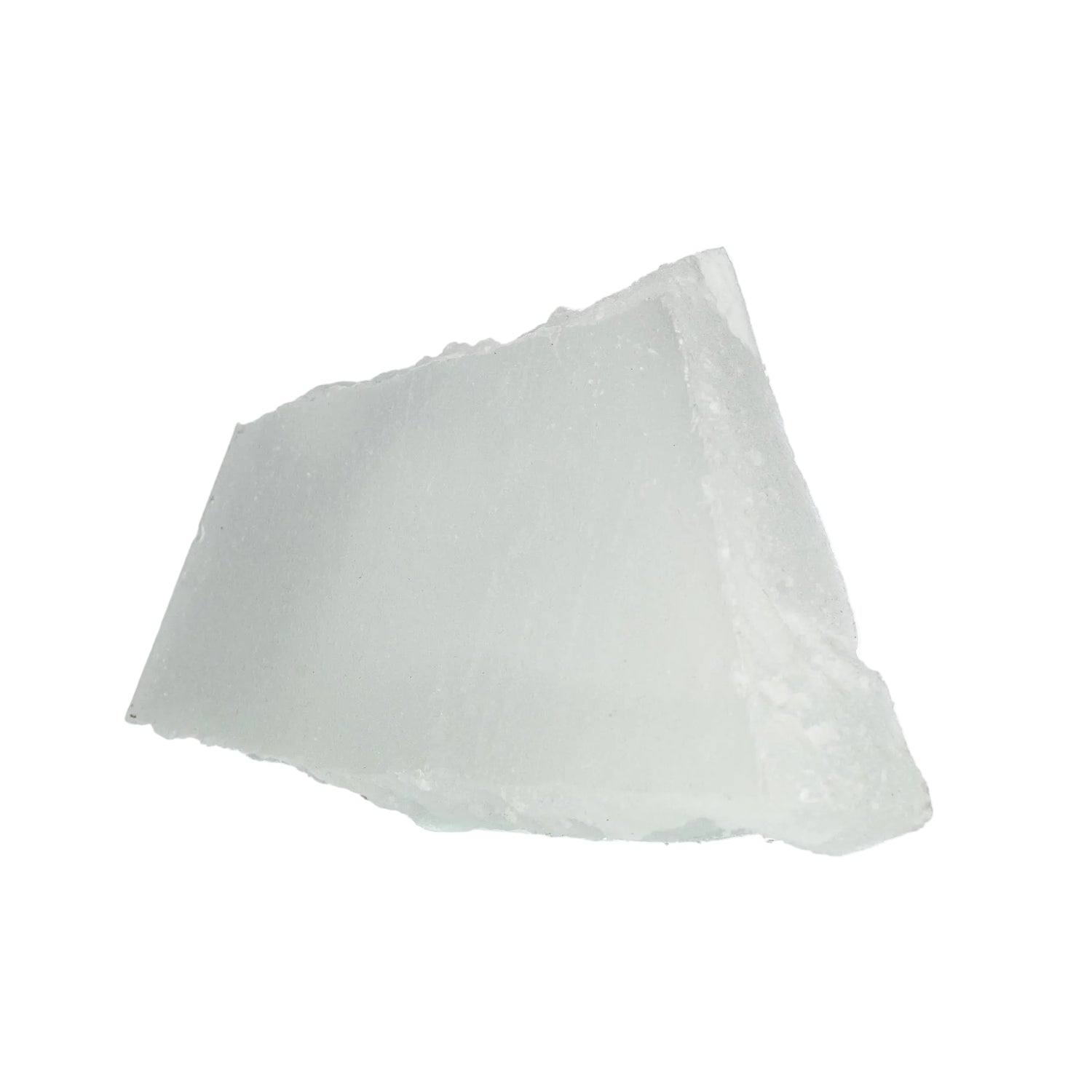 A chunk of white paraffin wax on a white background