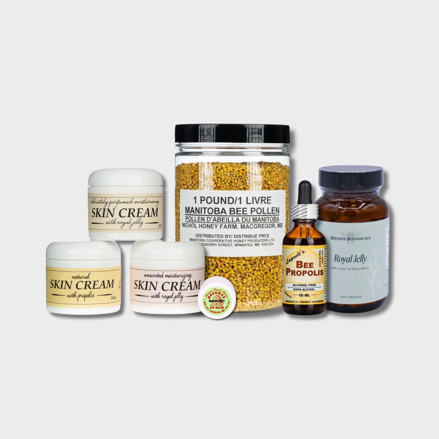 A collage of products that are produced from the hive, including propolis skin cream and a jar of bee pollen on a grey background