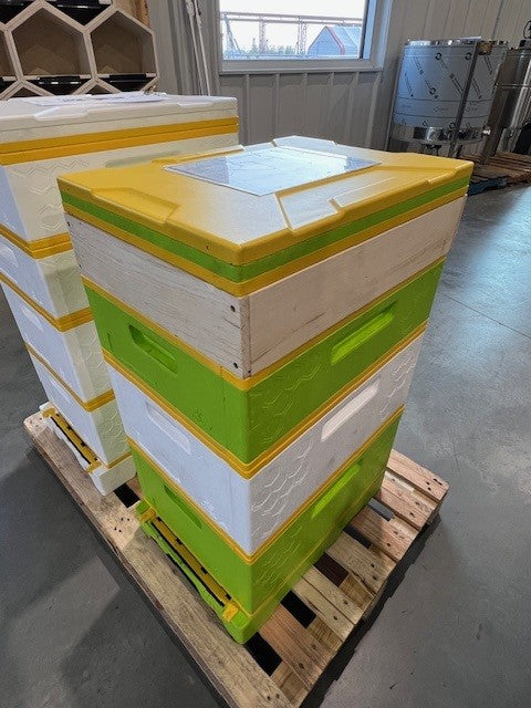 Example of blue plastic top feeder in a HiveIQ beehive setup