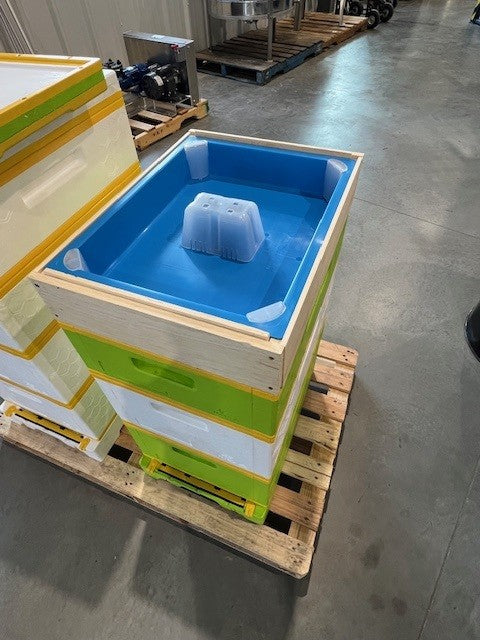 Example of blue plastic top feeder in a HiveIQ beehive setup