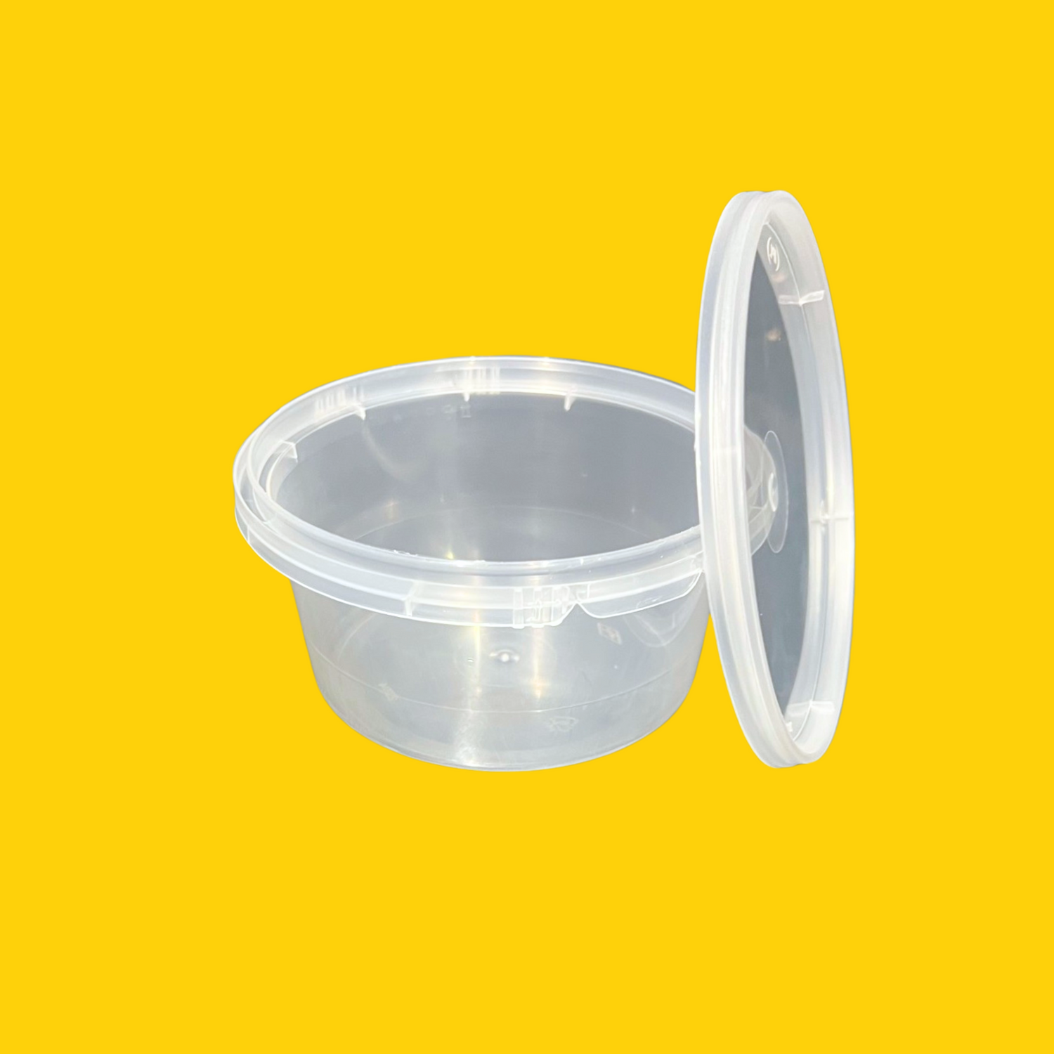 clear plastic tub with lid resting to the right on a white background