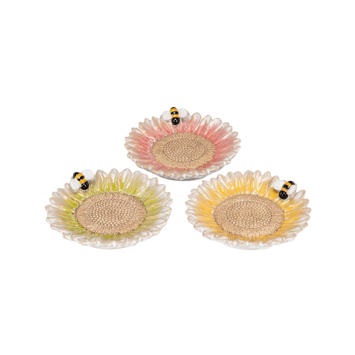 A set of three candle/wine bottle bases in the shape of a flower with a bee on a white background