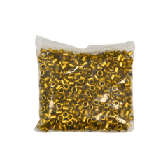 Bag of gold-coloured metal eyelets on a white background