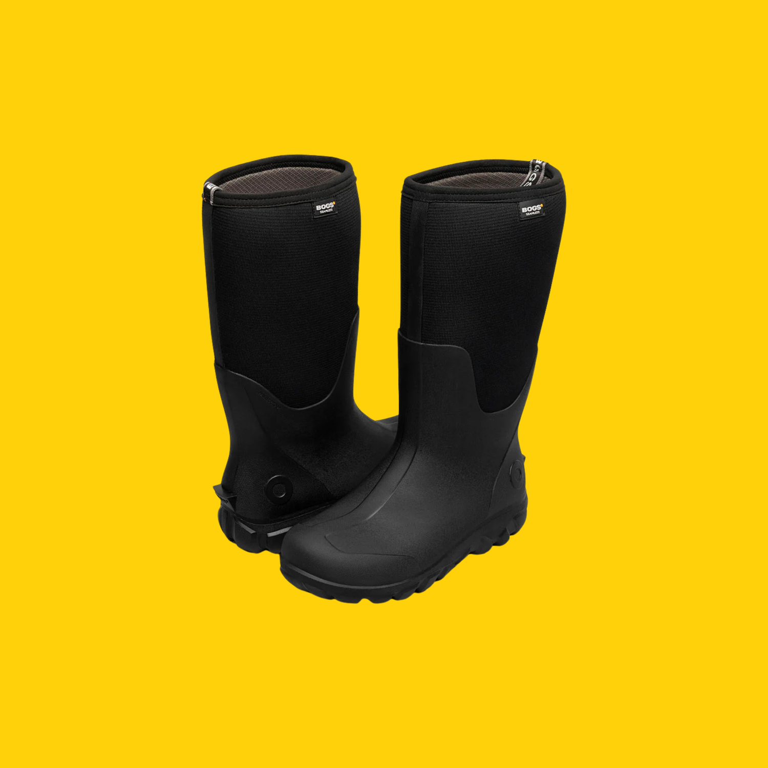 A pair of black boots on a yellow background