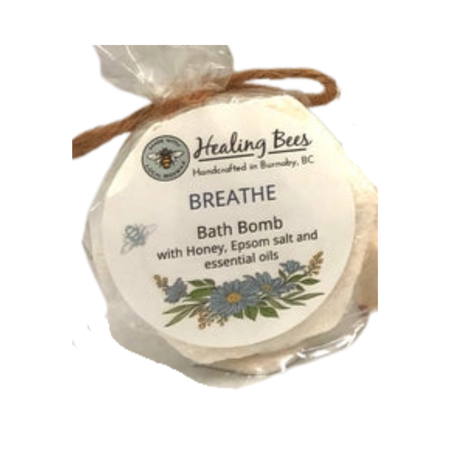 Bath bomb labeled 'Breathe' with honey, Epsom salt, and essential oils on a white background.