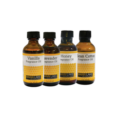 Four bottles of Mann Lake fragrance oils with labels for Vanilla, Lavender, Honey, and Clean Cotton on a white background.