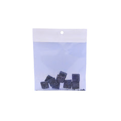 A clear plastic bag with several blue coloured dye buds shown on a plain white background.