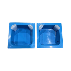 A blue top feeder with a patented corner access system, accompanied by corner caps on a white background