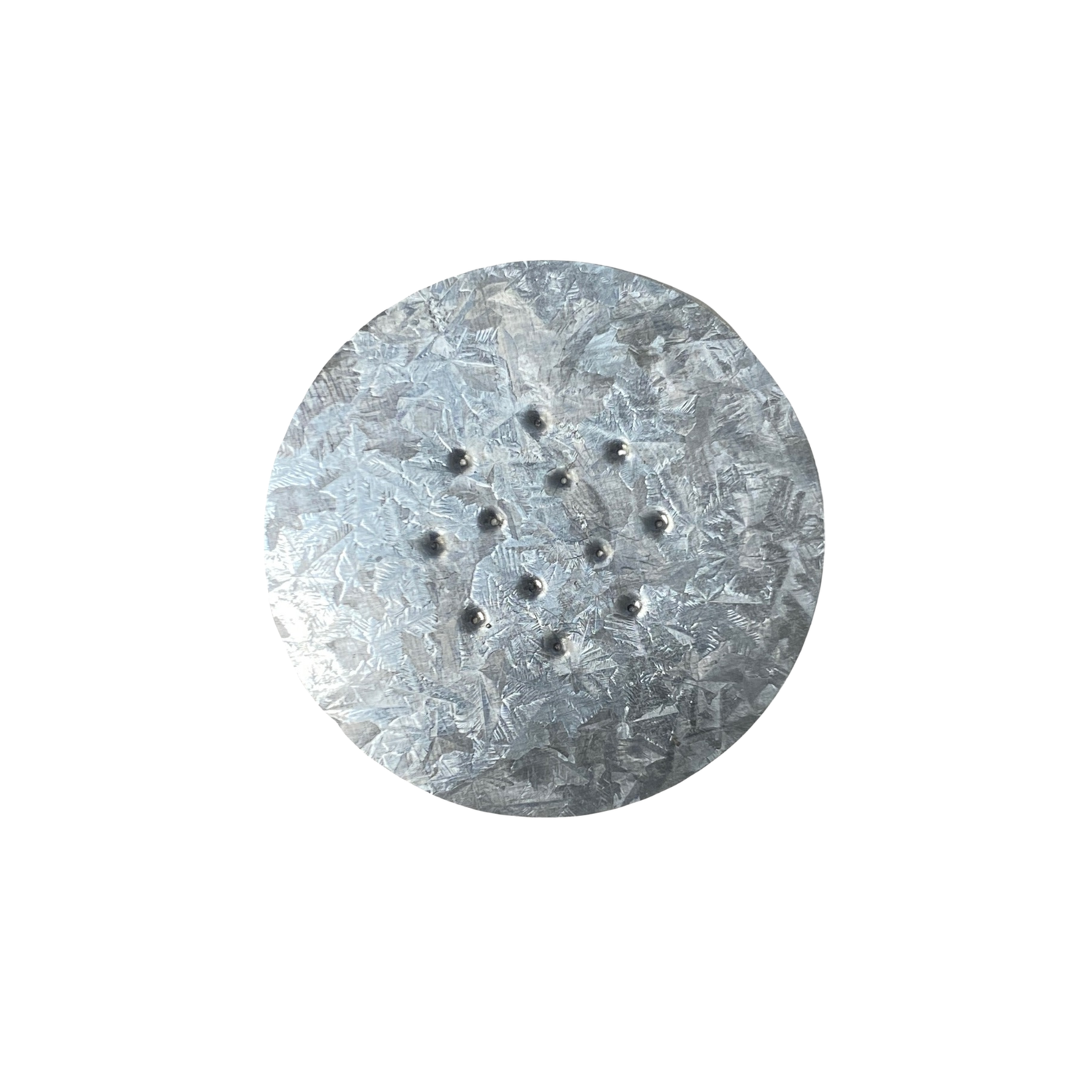 metal disc with perforations on a white background