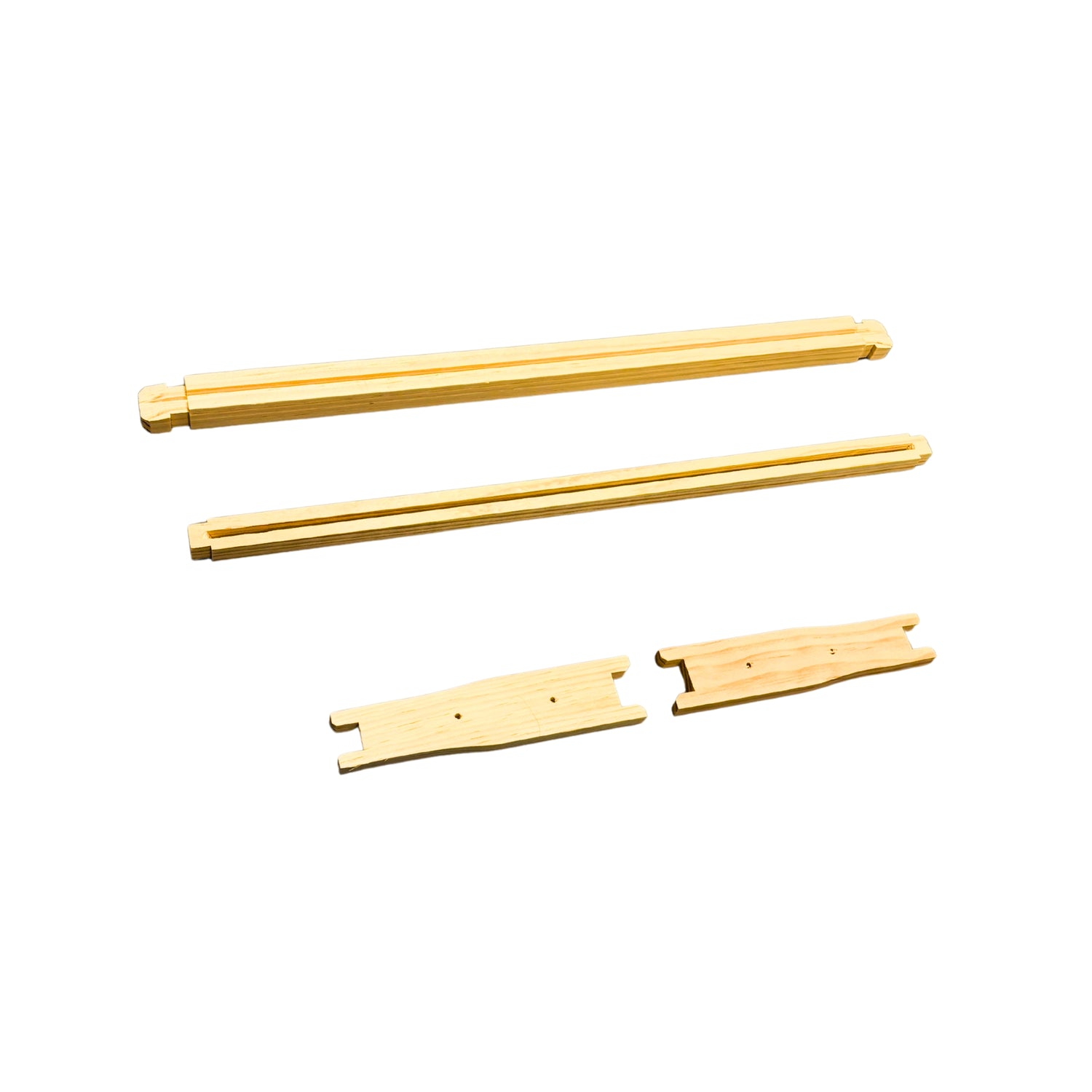 An unassembled medium frame used in beekeeping on a white background