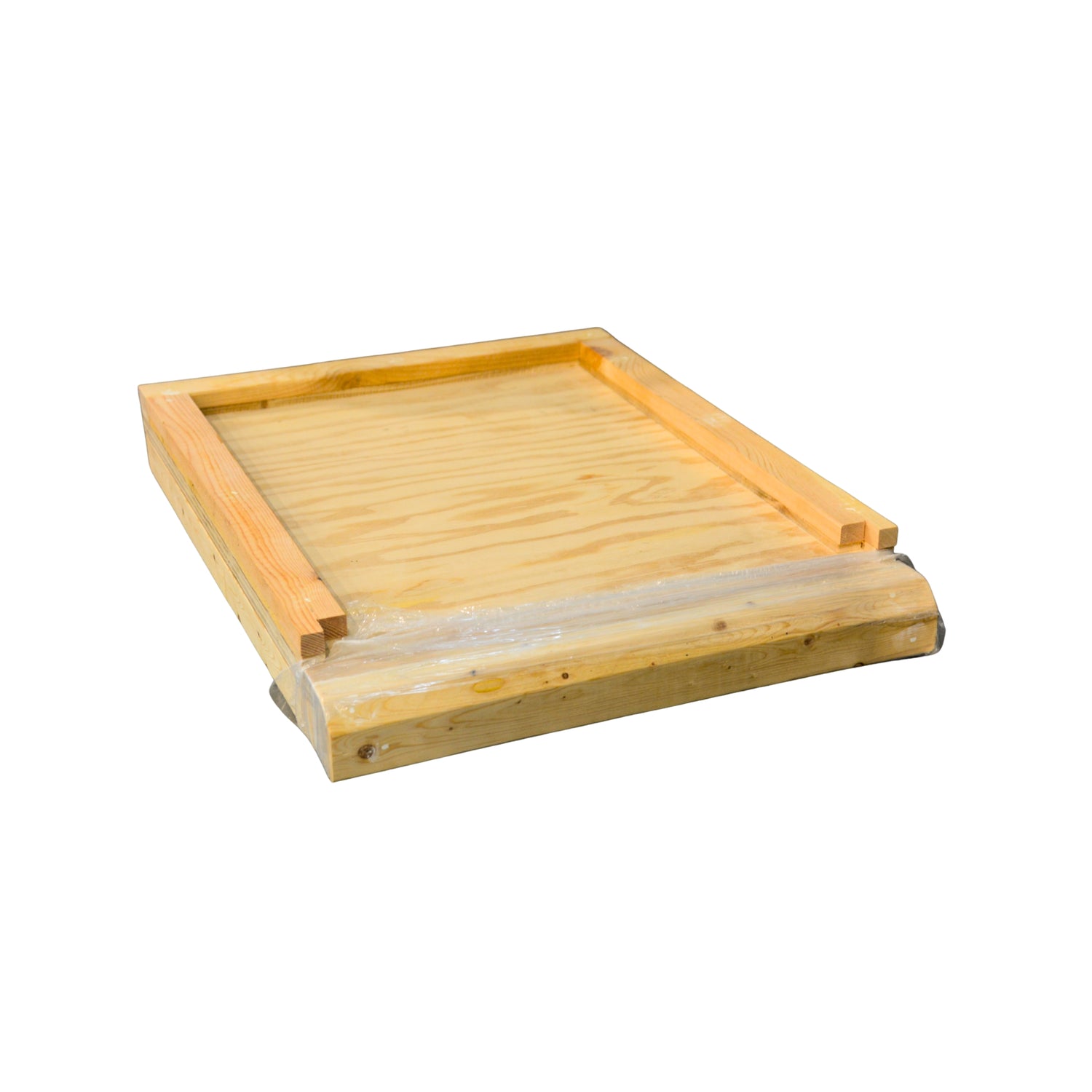 A solid wooden bottom board used in beekeeping on a white background