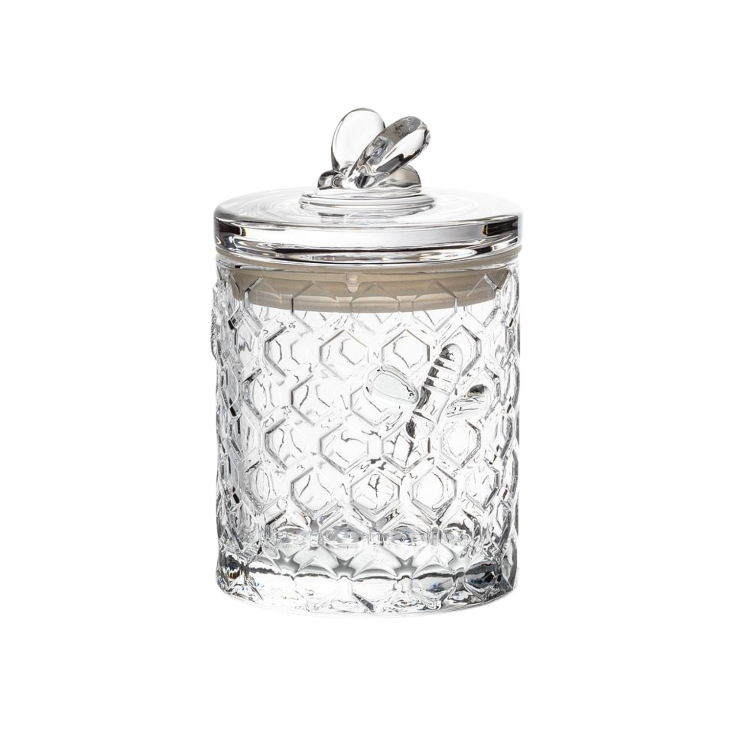 A glass honeycomb jar with a matching glass on a white background. 