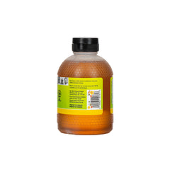 Bottle of honey with a label on a white background