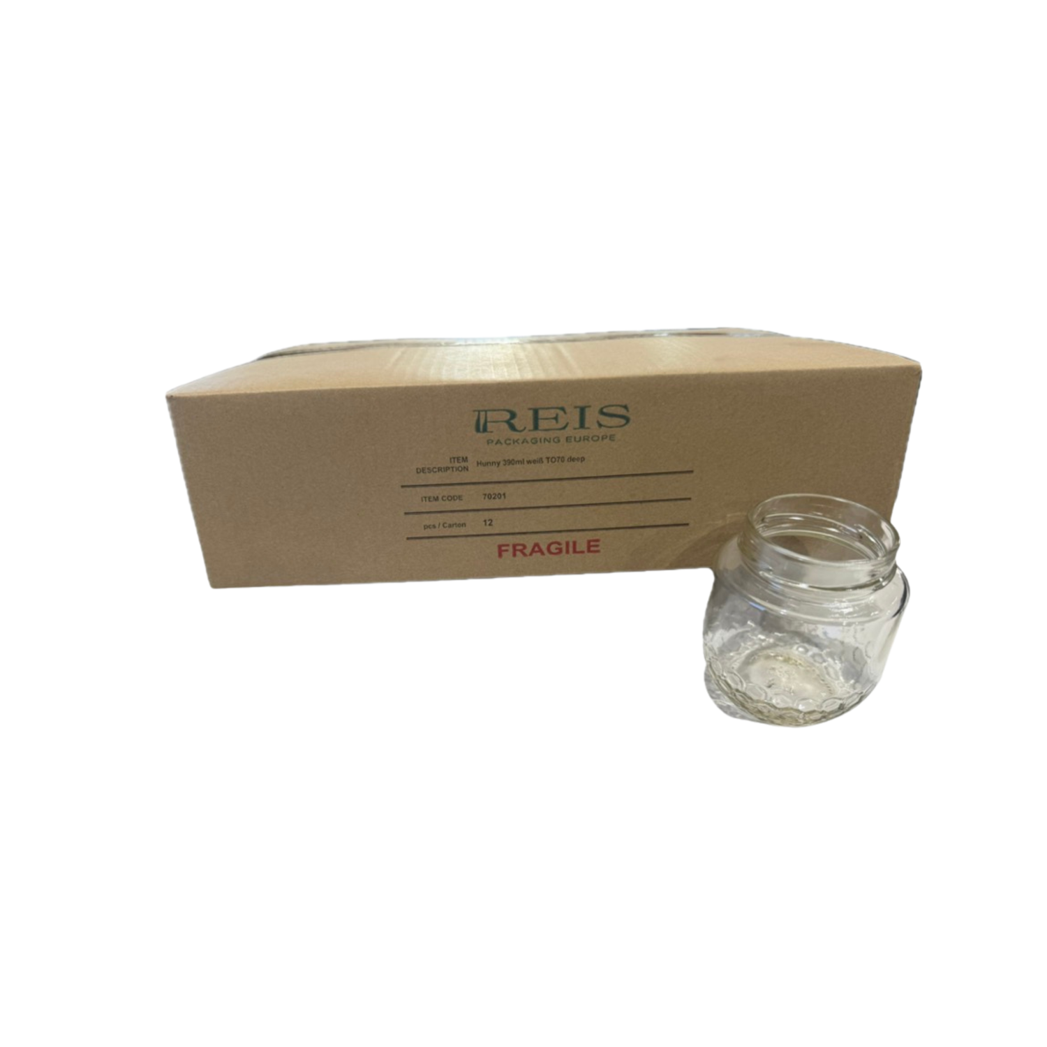 Clear glass jar in front of a cardboard box with 'REIS' branding on a white background