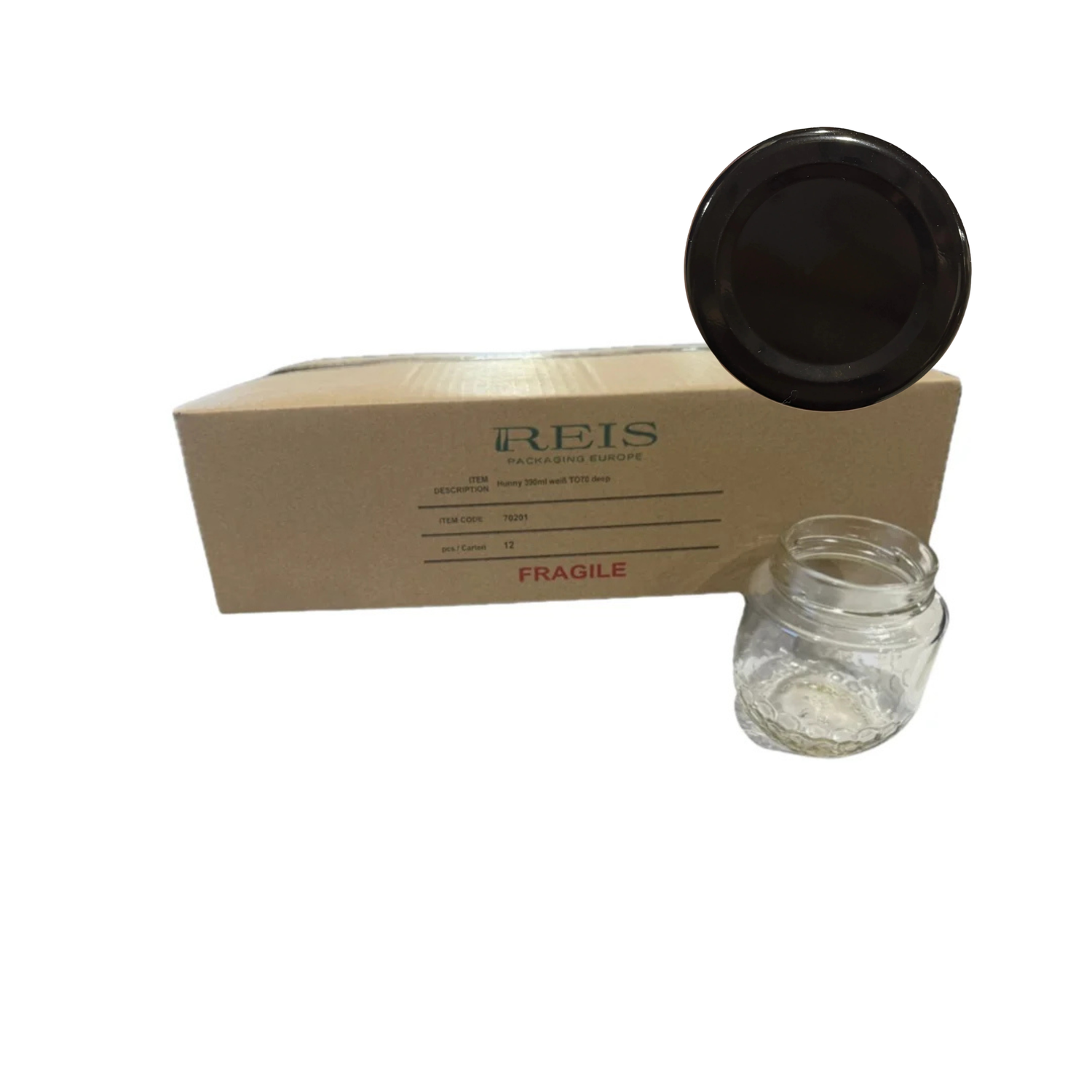 A black lid with a cardboard box of glass jars and one jar sitting next to the box on a white background