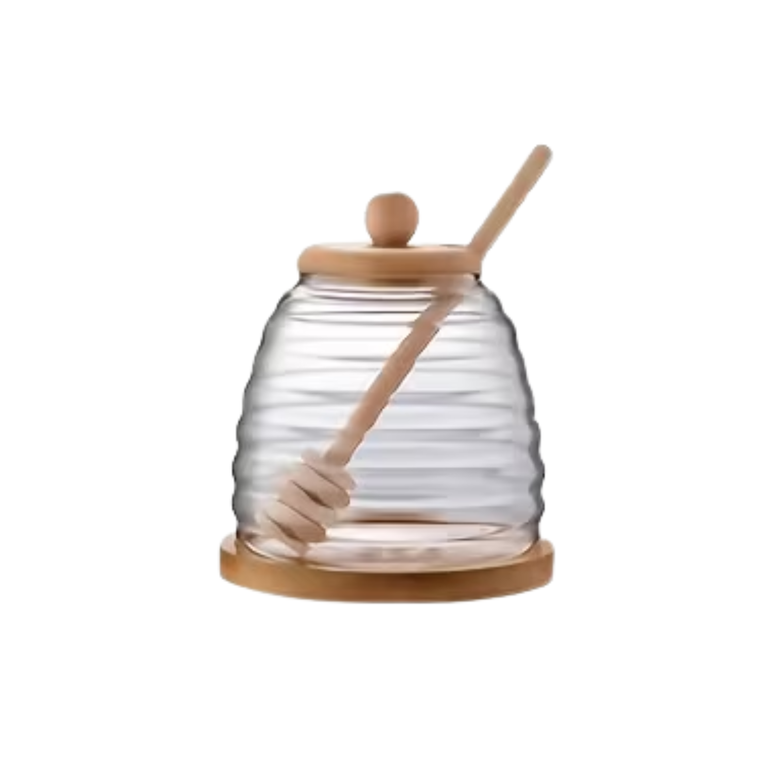 Clear glass honey jar with bamboo lid and dipper on a white background