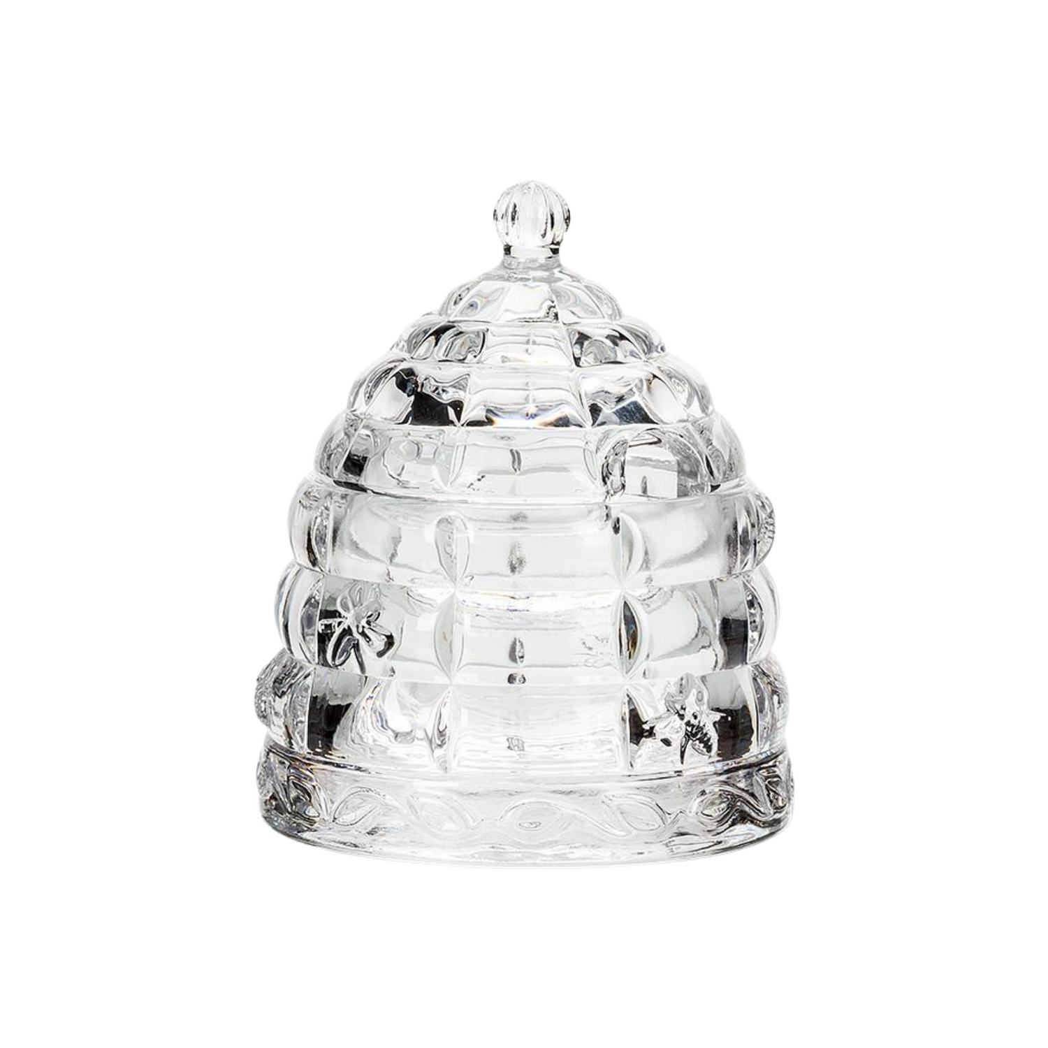 A glass honeypot beehive on a white background