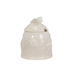 A white beehive covered pot on a white background
