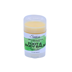 A single stick of foot and body balm featuring a white label with green accents and a pale yellow balm visible at the top, set against a plain white background