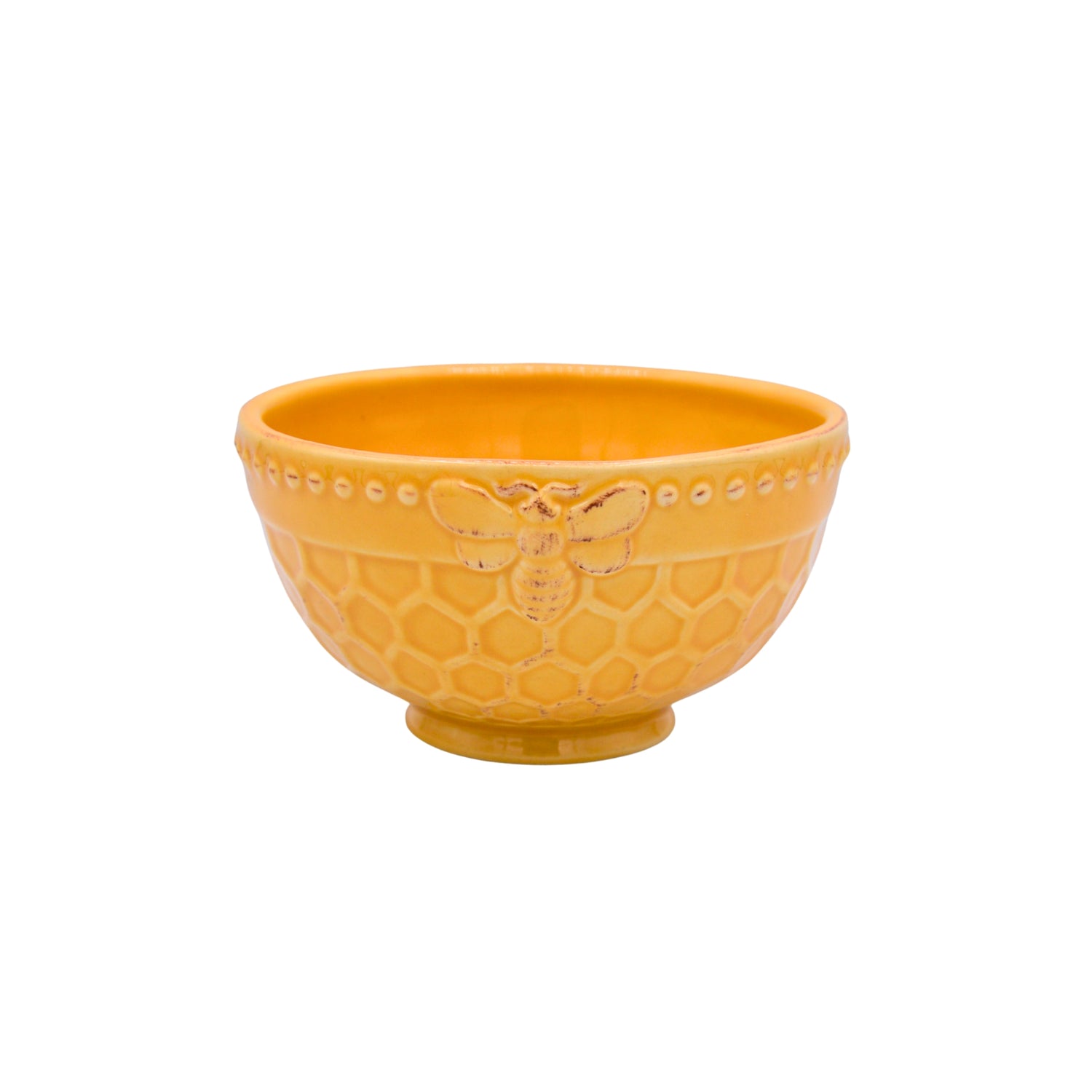 A yellow ceramic bowl with a honeycomb design on a white background