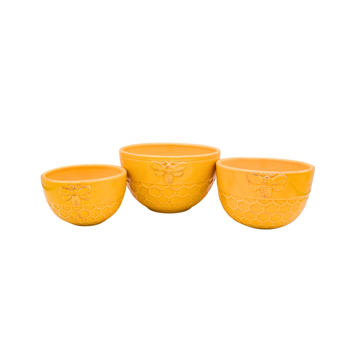 Three yellow ceramic bowls with embossed bee and honeycomb designs, arranged in ascending size on a plain white background.