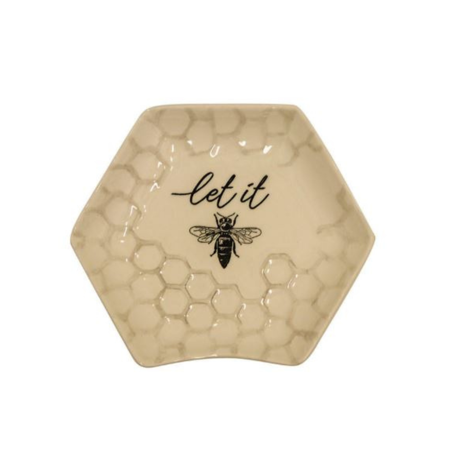 Hexagon-shaped ceramic trinket dish with a raised honeycomb texture, a bee illustration, and the words “let it” printed in black on a cream background.