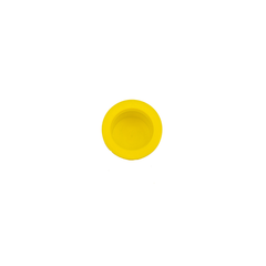 A yellow plastic plug used in beekeeping on a white background