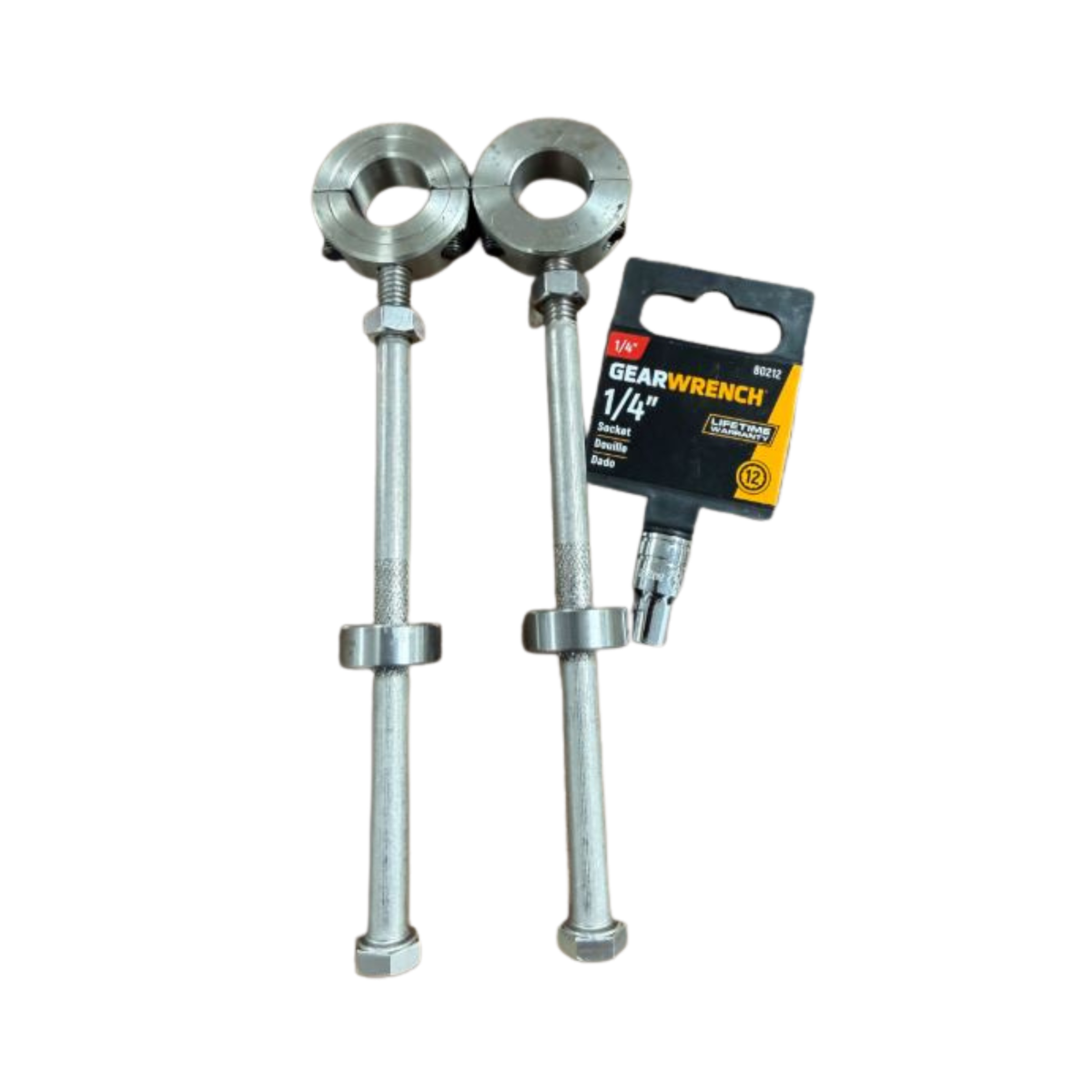 Two metal wrenches on a white surface with a Gearwrench packaging label.