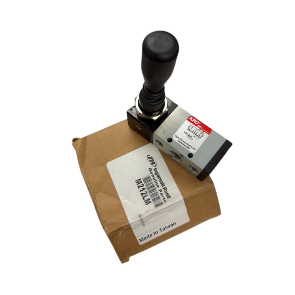 Control valve on a cardboard box with a label, on a white surface.