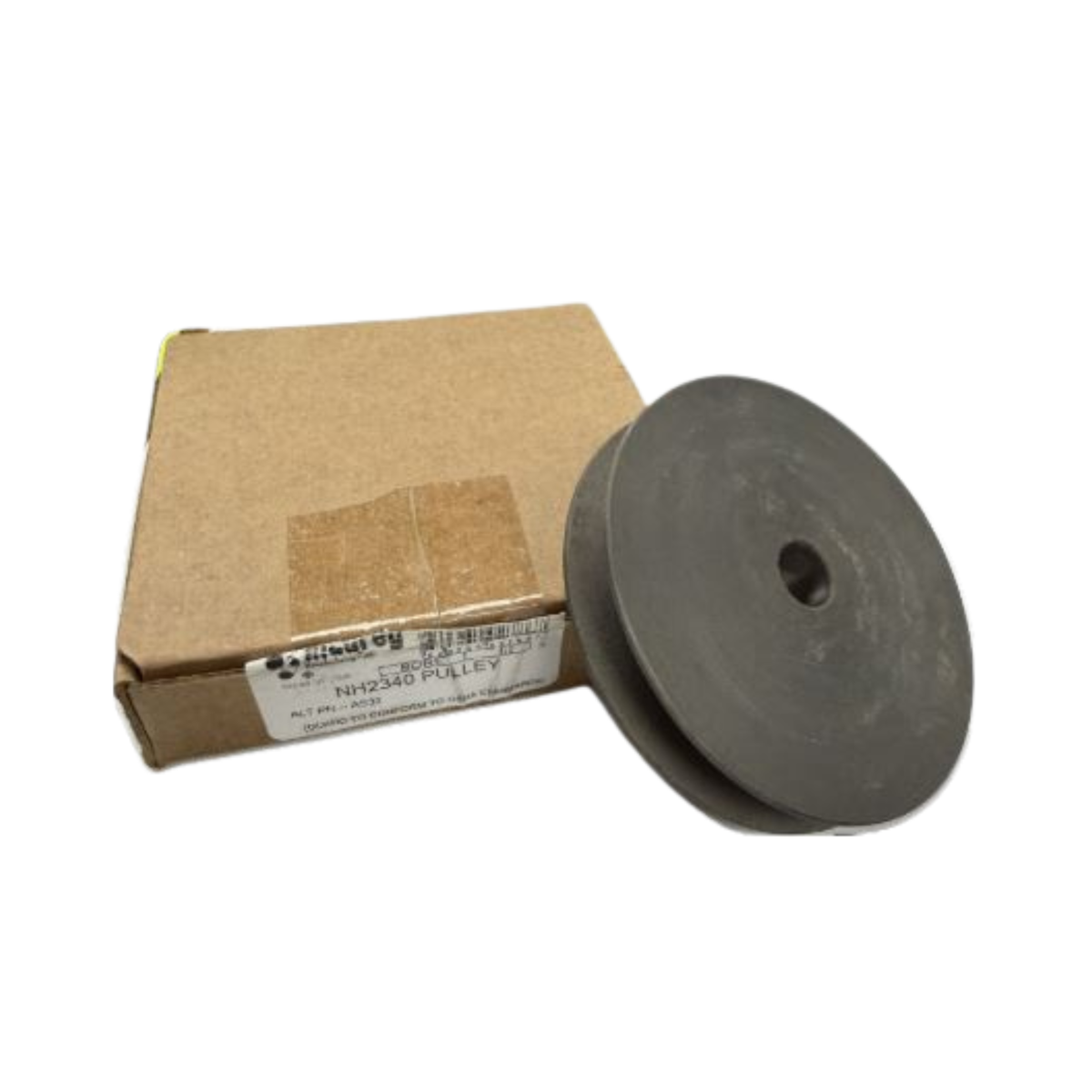 Metal pulley wheel next to a cardboard box with a label on a white background