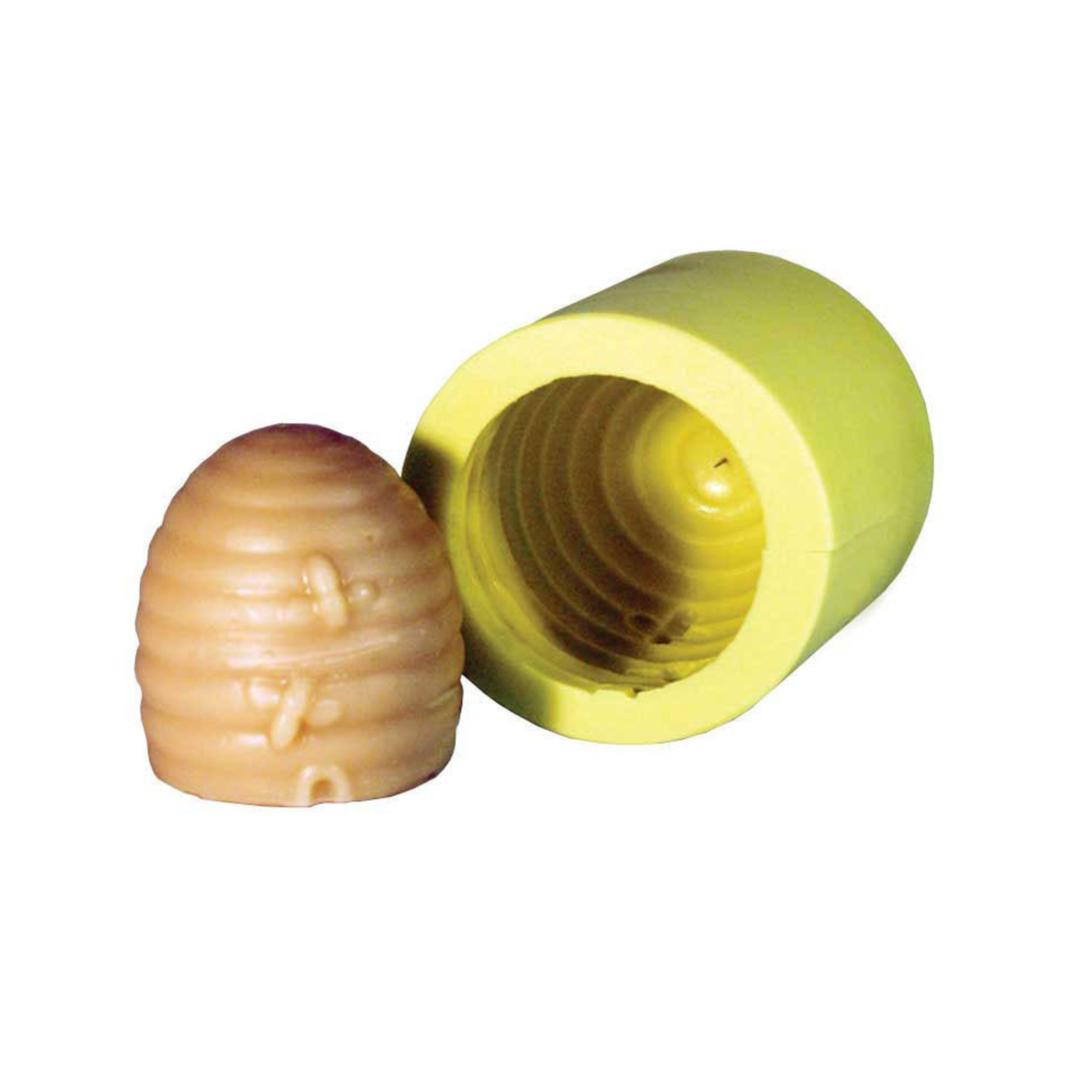 A yellow silicone mold with an imprint of a skep next to its produced candle on a white background