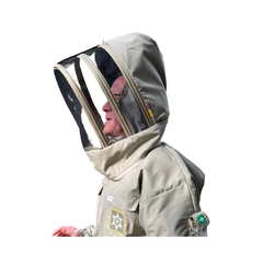 A person wearing a light beige beekeeping suit with a clear mesh hood and face shield, shown in profile against a plain white background.