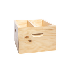 An example of the wooden beehive division board in use in a brood box, displayed on a white background