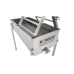 A close up of a KONIGIN brand uncapping table made of stainless steel, designed for honey processing, featuring two work stands and frame holders.