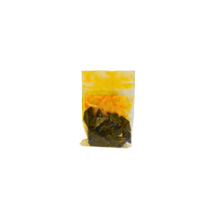 A small clear plastic pouch containing black dye chips shown on a plain white background.