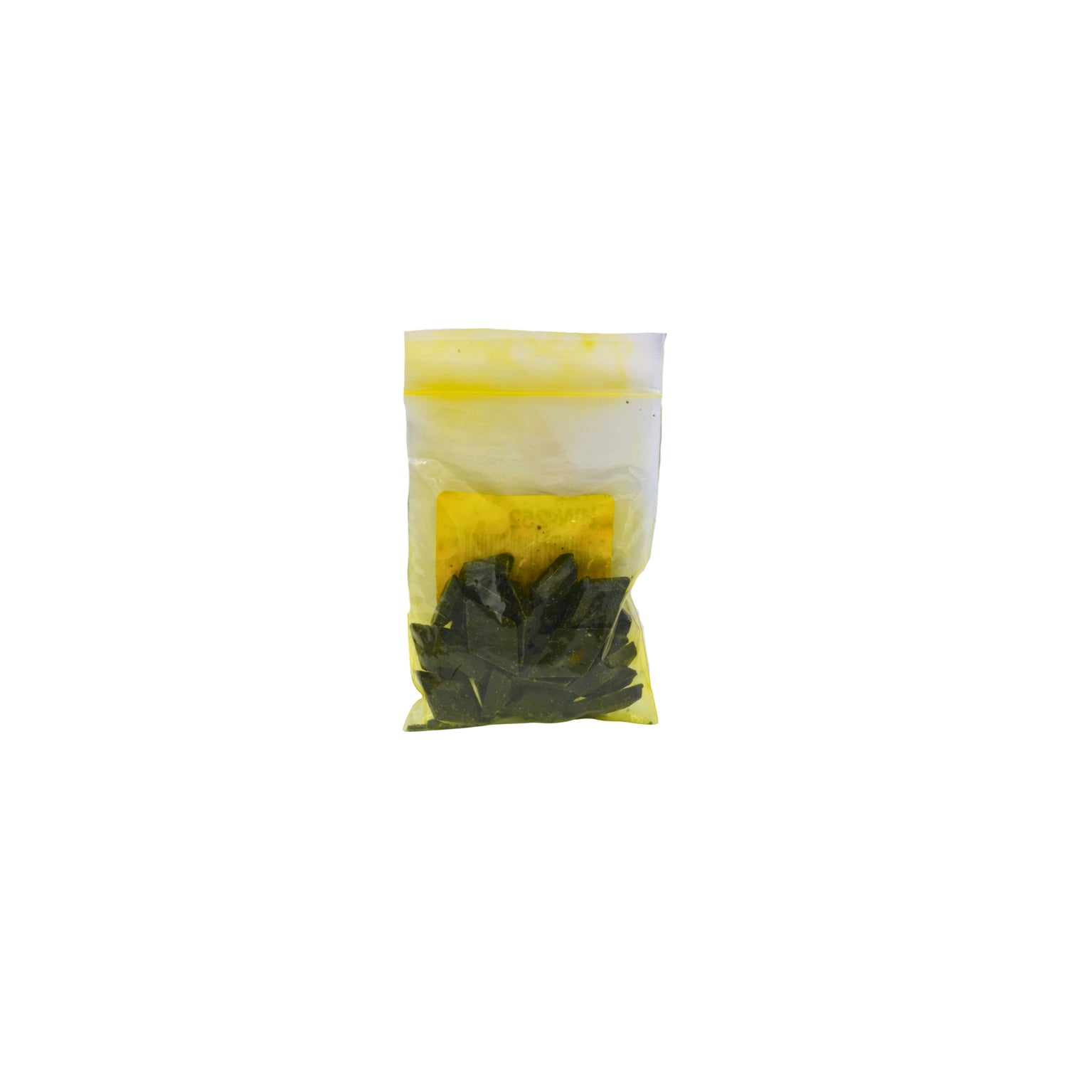A small clear plastic pouch containing Forrest Green dye chips shown on a plain white background.
