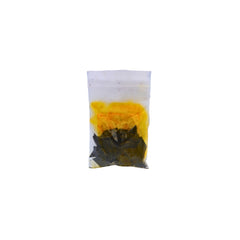 A small clear plastic pouch containing purple dye chips shown on a plain white background.